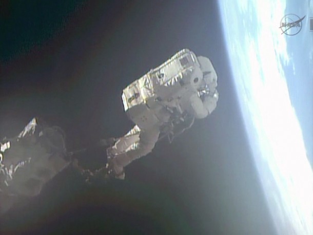 Flight Engineer Luca Parmitano rides Canadarm2 to an International Space Station worksite during Tuesday's Expedition 36 spacewalk. Image Credit: NASA TV Flight Engineer Luca Parmitano rides Canadarm2 to an International Space Station worksite during Tuesday's Expedition 36 spacewalk. Image Credit: NASA TV