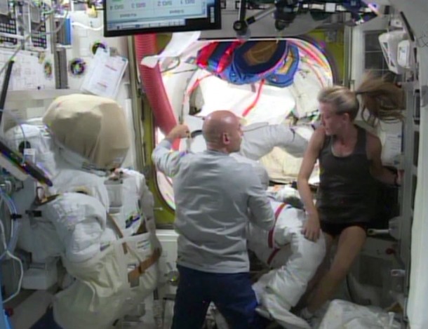 Flight Engineers Luca Parmitano (left) and Karen Nyberg work with U.S. spacesuits in the equipment lock of the International Space Station's Quest airlock. Image Credit: NASA TV Flight Engineers Luca Parmitano (left) and Karen Nyberg work with U.S. spacesuits in the equipment lock of the International Space Station's Quest airlock. Image Credit: NASA TV