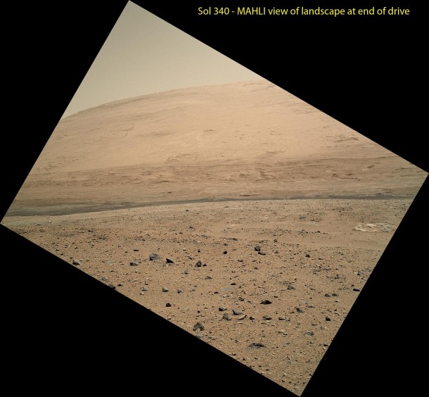 The Mars Hand Lens Imager (MAHLI) camera on NASA's Curiosity rover is carried at an angle when the rover's arm is stowed for driving. Still, the camera is able to record views of the terrain Curiosity is crossing in Gale Crater, and rotating the image 150 degrees provides this right-side-up scene. The scene is toward the south, including a portion of Mount Sharp and a band of dark dunes in front of the mountain. It was taken on the 140th Martian day, or sol, of Curiosity's work on Mars, shortly after Curiosity finished a 329.1-foot (100.3-meter) drive on that sol. The drive was twice as long as any previous sol's drive by Curiosity. Image Credit: NASA/JPL-Caltech/MSSS The Mars Hand Lens Imager (MAHLI) camera on NASA's Curiosity rover is carried at an angle when the rover's arm is stowed for driving. Still, the camera is able to record views of the terrain Curiosity is crossing in Gale Crater, and rotating the image 150 degrees provides this right-side-up scene. The scene is toward the south, including a portion of Mount Sharp and a band of dark dunes in front of the mountain. It was taken on the 140th Martian day, or sol, of Curiosity's work on Mars, shortly after Curiosity finished a 329.1-foot (100.3-meter) drive on that sol. The drive was twice as long as any previous sol's drive by Curiosity. Image Credit: NASA/JPL-Caltech/MSSS