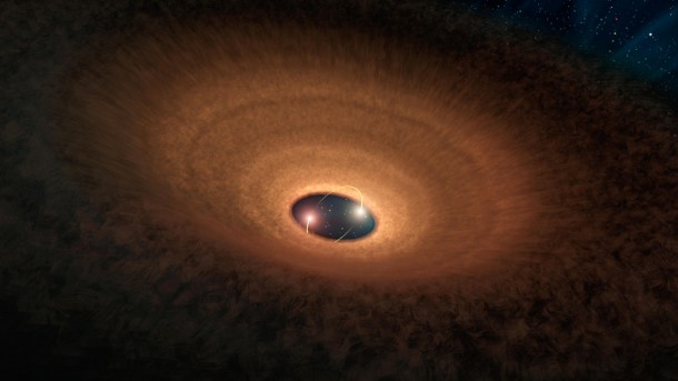 In this artist's impression, a disk of dusty material leftover from star formation girds two young stars like a hula hoop. As the two stars whirl around each other, they periodically peek out from the disk, making the system appear to "blink" every 93 days. Image credit: NASA/JPL-Caltech In this artist's impression, a disk of dusty material leftover from star formation girds two young stars like a hula hoop. As the two stars whirl around each other, they periodically peek out from the disk, making the system appear to "blink" every 93 days. Image credit: NASA/JPL-Caltech