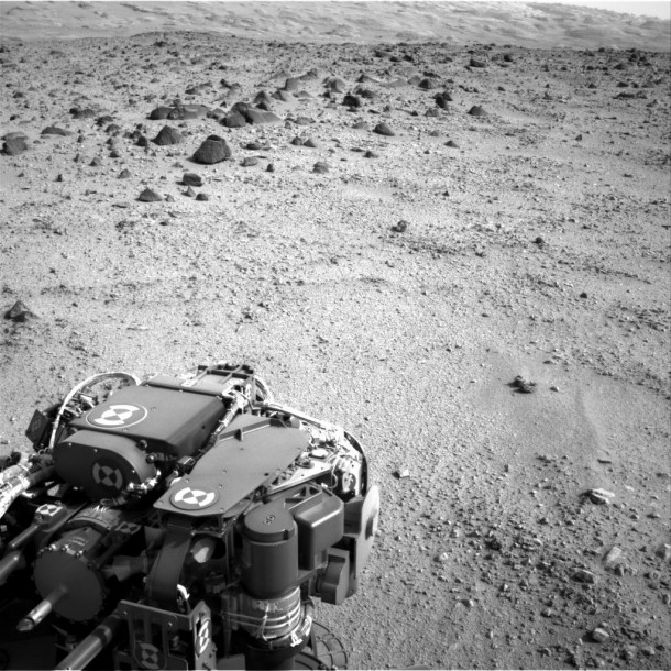 Lower slopes of Mount Sharp appear at the top of this image taken by the right Navigation Camera (Navcam) of NASA's Mars rover Curiosity at the end of a drive of about 135 feet (41 meters) during the 329th Martian day, or sol, of the rover's work on Mars (July 9, 2013). Credit: NASA/JPL-Caltech Lower slopes of Mount Sharp appear at the top of this image taken by the right Navigation Camera (Navcam) of NASA's Mars rover Curiosity at the end of a drive of about 135 feet (41 meters) during the 329th Martian day, or sol, of the rover's work on Mars (July 9, 2013). Credit: NASA/JPL-Caltech
