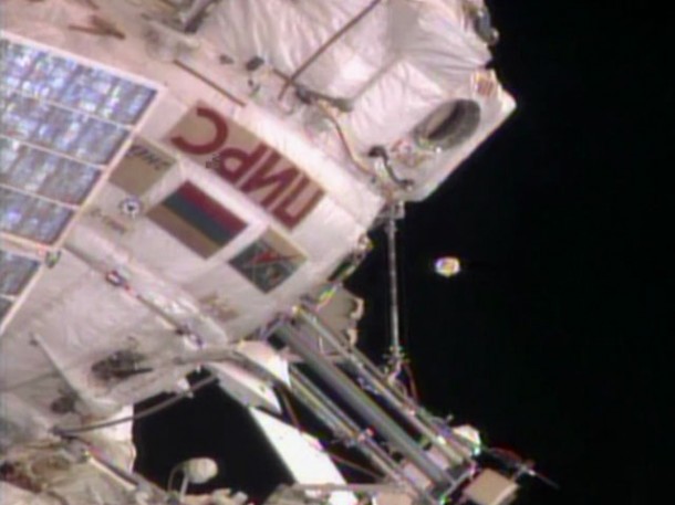 An unidentified object floats near the International Space Station. Russian ground controllers later identified it as an antenna cover from the Zvezda service module. Image Credit: NASA TV An unidentified object floats near the International Space Station. Russian ground controllers later identified it as an antenna cover from the Zvezda service module. Image Credit: NASA TV