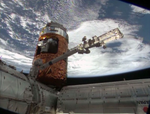 The H-II Transfer Vehicle-4 with its Exposed Pallet installed inside the unpressurized section and Canadarm2 are featured in this image from the International Space Station. Image Credit: NASA TV The H-II Transfer Vehicle-4 with its Exposed Pallet installed inside the unpressurized section and Canadarm2 are featured in this image from the International Space Station. Image Credit: NASA TV