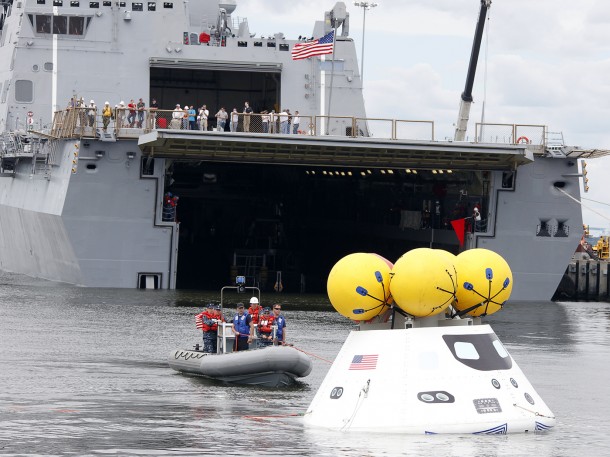 During the stationary recovery test of Orion at Norfolk Naval Base, divers attached tow lines and led the test capsule to a flooded well deck. Image Credit: NASA/Dave Bowman During the stationary recovery test of Orion at Norfolk Naval Base, divers attached tow lines and led the test capsule to a flooded well deck. Image Credit: NASA/Dave Bowman