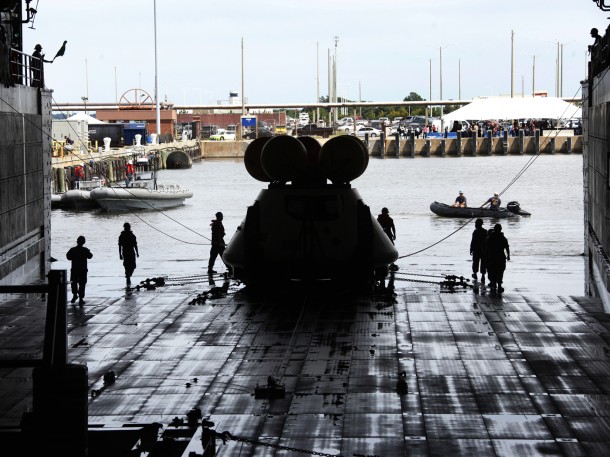 With the well deck drained, the Orion capsule is recovered aboard the USS Arlington and the stationary recovery test is complete. Image Credit: NASA/Dave Bowman With the well deck drained, the Orion capsule is recovered aboard the USS Arlington and the stationary recovery test is complete. Image Credit: NASA/Dave Bowman