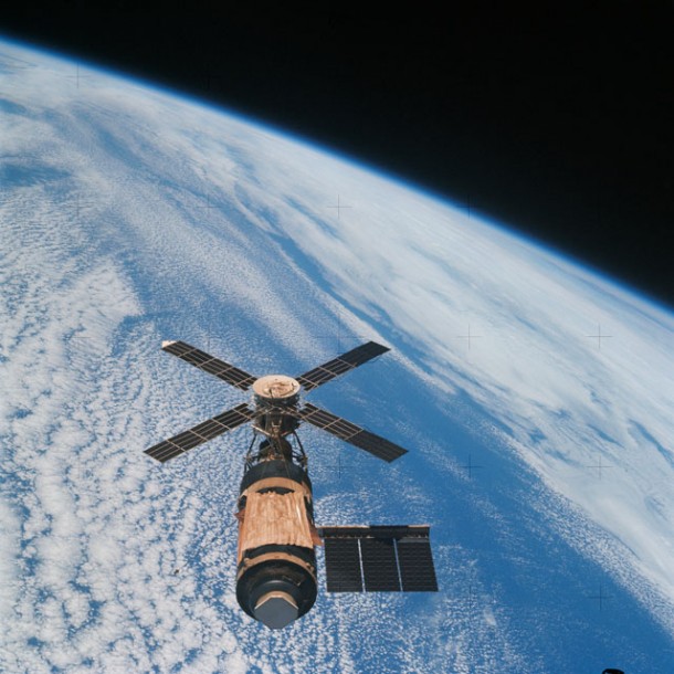 An overhead view of the Skylab space station in Earth's orbit as photographed from the Skylab 4 Command and Service Modules (CSM) during the final fly-around by the CSM before returning home. The space station is contrasted against a cloud-covered Earth. Image Credit: NASA An overhead view of the Skylab space station in Earth's orbit as photographed from the Skylab 4 Command and Service Modules (CSM) during the final fly-around by the CSM before returning home. The space station is contrasted against a cloud-covered Earth. Image Credit: NASA
