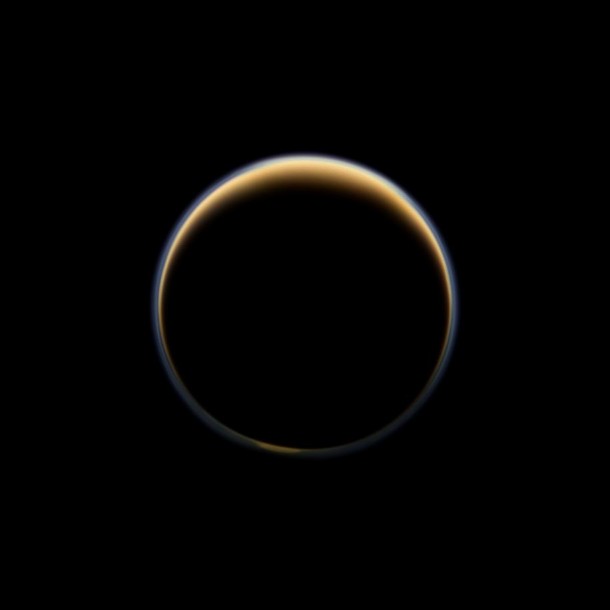 NASA's Cassini spacecraft looks toward the night side of Saturn's largest moon and sees sunlight scattering through the periphery of Titan's atmosphere and forming a ring of color. Image credit: NASA/JPL-Caltech/Space Science Institute NASA's Cassini spacecraft looks toward the night side of Saturn's largest moon and sees sunlight scattering through the periphery of Titan's atmosphere and forming a ring of color. Image credit: NASA/JPL-Caltech/Space Science Institute