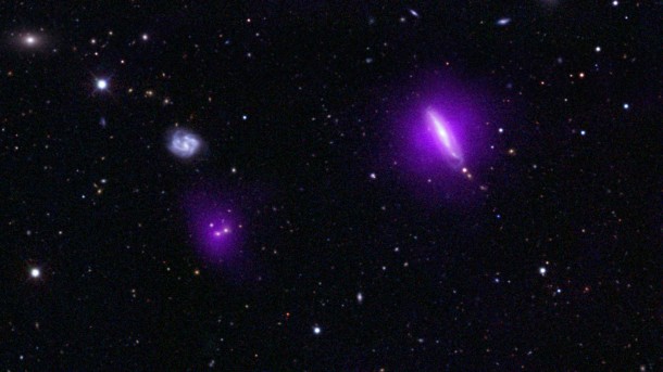 An optical color image of galaxies is seen here overlaid with X-ray data (magenta) from NASA's Nuclear Spectroscopic Telescope Array (NuSTAR). Image credit: NASA/JPL-Caltech An optical color image of galaxies is seen here overlaid with X-ray data (magenta) from NASA's Nuclear Spectroscopic Telescope Array (NuSTAR). Image credit: NASA/JPL-Caltech