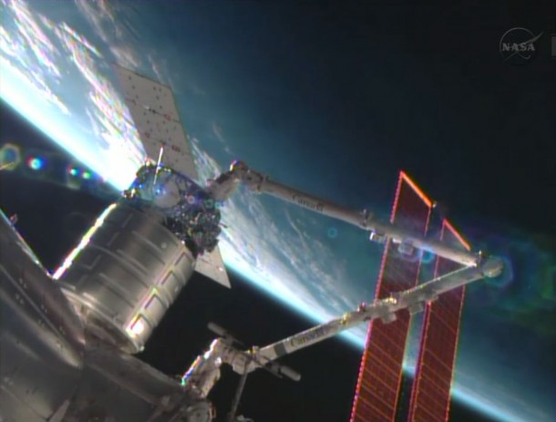 The Cygnus commercial resupply craft is installed by the Canadarm2 to the Harmony node. Image Credit: NASA TV The Cygnus commercial resupply craft is installed by the Canadarm2 to the Harmony node. Image Credit: NASA TV