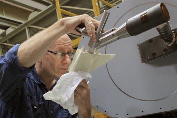 An engineer at NASA's Langley Research Center prepares a 10-inch ceramic model of the Sierra Nevada Corporation Dream Chaser spacecraft for high-speed wind tunnel testing. Image Credit: NASA/David Bowman An engineer at NASA's Langley Research Center prepares a 10-inch ceramic model of the Sierra Nevada Corporation Dream Chaser spacecraft for high-speed wind tunnel testing. Image Credit: NASA/David Bowman