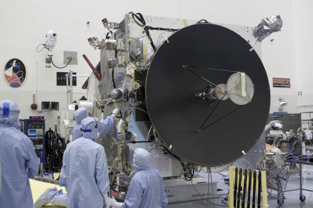 Engineers work on the MAVEN spacecraft, which is dominated by the high-gain antenna that is crucial to communications with NASA's Deep Space Network. Image Credit: NASA/Kim Shiflett Engineers work on the MAVEN spacecraft, which is dominated by the high-gain antenna that is crucial to communications with NASA's Deep Space Network. Image Credit: NASA/Kim Shiflett