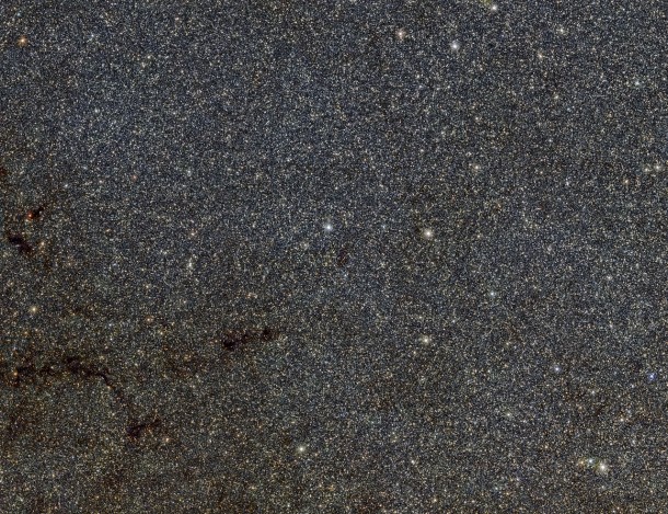 This large star-filled picture is a tiny part of the VVV survey conducted by ESO’s VISTA infrared survey telescope. It shows a patch of sky in the direction of the centre of the Milky Way and includes many thousands of stars that form part of the Milky Way bulge. The star catalogues from the VVV survey have been used to map out the shape of the bulge more accurately than ever before. Credit: ESO/VVV Survey/D. Minniti, I. Toledo This large star-filled picture is a tiny part of the VVV survey conducted by ESO’s VISTA infrared survey telescope. It shows a patch of sky in the direction of the centre of the Milky Way and includes many thousands of stars that form part of the Milky Way bulge. The star catalogues from the VVV survey have been used to map out the shape of the bulge more accurately than ever before. Credit: ESO/VVV Survey/D. Minniti, I. Toledo