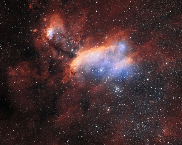 The glowing jumble of gas clouds visible in this new image make up a huge stellar nursery nicknamed the Prawn Nebula. Taken using the VLT Survey Telescope at ESO’s Paranal Observatory in Chile, this may well be the sharpest picture ever taken of this object. It shows clumps of hot new-born stars nestled in among the clouds that make up the nebula. This image also contains information from images of this object taken by Martin Pugh. Credit: ESO. Acknowledgement: Martin Pugh The glowing jumble of gas clouds visible in this new image make up a huge stellar nursery nicknamed the Prawn Nebula. Taken using the VLT Survey Telescope at ESO’s Paranal Observatory in Chile, this may well be the sharpest picture ever taken of this object. It shows clumps of hot new-born stars nestled in among the clouds that make up the nebula. This image also contains information from images of this object taken by Martin Pugh. Credit: ESO. Acknowledgement: Martin Pugh