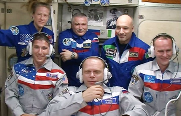 The new six-member Expedition 37 crew gathers inside the Zvezda service module for a welcoming ceremony. Image Credit: NASA TV The new six-member Expedition 37 crew gathers inside the Zvezda service module for a welcoming ceremony. Image Credit: NASA TV