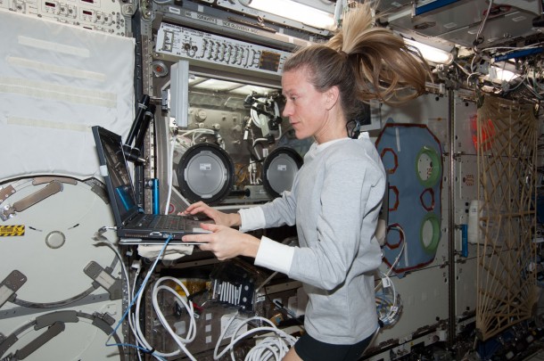 Flight Engineer Karen Nyberg enters data into a computer near the Microgravity Science Glovebox in the Destiny laboratory of the International Space Station. Image Credit: NASA Flight Engineer Karen Nyberg enters data into a computer near the Microgravity Science Glovebox in the Destiny laboratory of the International Space Station. Image Credit: NASA