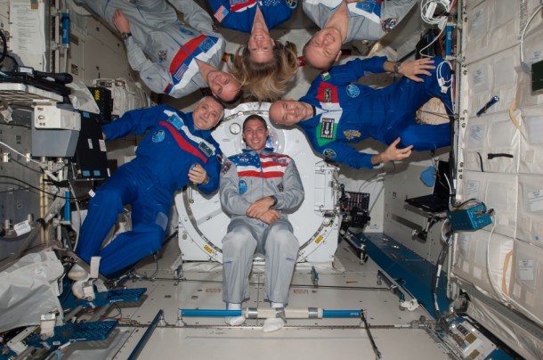 Expedition 37 crew members pose for an in-flight crew portrait in the Kibo laboratory of the International Space Station. Expedition 37 crew members pose for an in-flight crew portrait in the Kibo laboratory of the International Space Station.