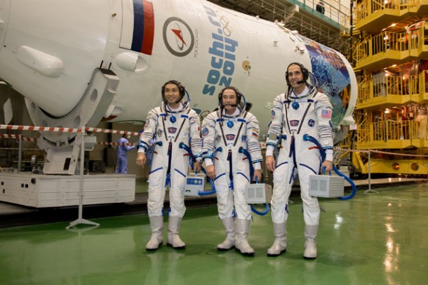 In the Integration Facility at the Baikonur Cosmodrome in Kazakhstan, Flight Engineers Koichi Wakata (left), Mikkhail Tyurin (center) and Rick Mastracchio pose for pictures in front of the upper stage of the Soyuz booster rocket. Image Credit: NASA/Victor Zelentsov In the Integration Facility at the Baikonur Cosmodrome in Kazakhstan, Flight Engineers Koichi Wakata (left), Mikkhail Tyurin (center) and Rick Mastracchio pose for pictures in front of the upper stage of the Soyuz booster rocket. Image Credit: NASA/Victor Zelentsov