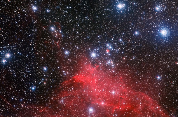 The Wide Field Imager on the MPG/ESO 2.2-metre telescope at ESO’s La Silla Observatory in Chile has captured the best image so far of the star cluster NGC 3572, a gathering of young stars, and its spectacular surroundings. This new image shows how the clouds of gas and dust around the cluster have been sculpted into whimsical bubbles, arcs and the odd features known as elephant trunks by the stellar winds flowing from the bright stars. The brightest of these cluster stars are heavier than the Sun and will end their short lives as supernova explosions. Credit: ESO/G. Beccari The Wide Field Imager on the MPG/ESO 2.2-metre telescope at ESO’s La Silla Observatory in Chile has captured the best image so far of the star cluster NGC 3572, a gathering of young stars, and its spectacular surroundings. This new image shows how the clouds of gas and dust around the cluster have been sculpted into whimsical bubbles, arcs and the odd features known as elephant trunks by the stellar winds flowing from the bright stars. The brightest of these cluster stars are heavier than the Sun and will end their short lives as supernova explosions. Credit: ESO/G. Beccari