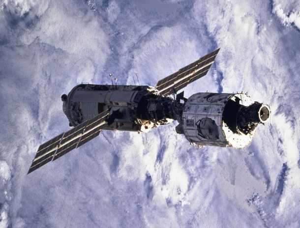 Blanketing clouds form the backdrop for this 70mm scene of the connected Zarya and Unity modules after having been released from Endeavour's cargo bay a bit earlier. Image Credit: NASA Blanketing clouds form the backdrop for this 70mm scene of the connected Zarya and Unity modules after having been released from Endeavour's cargo bay a bit earlier. Image Credit: NASA