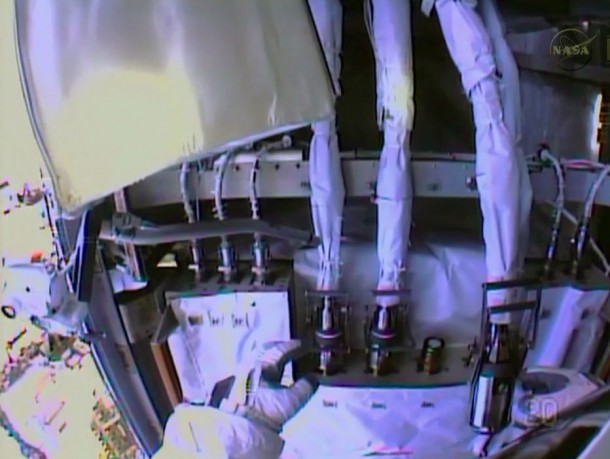 Spacewalker Rick Mastracchio works to disconnect the fluid lines from the degraded pump module in this view from the NASA astronaut's helmet camera. Image Credit: NASA TV Spacewalker Rick Mastracchio works to disconnect the fluid lines from the degraded pump module in this view from the NASA astronaut's helmet camera. Image Credit: NASA TV