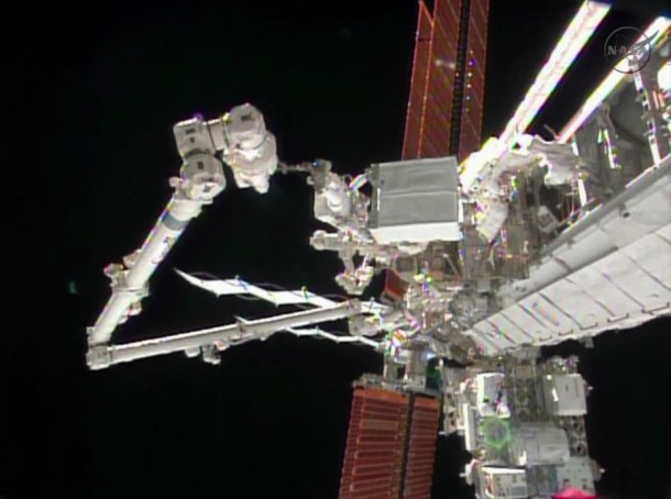Astronaut Rick Mastracchio holds the degraded pump module while the International Space Station's robotic arm guides the module to a grapple fixture. Image Credit: NASA TV Astronaut Rick Mastracchio holds the degraded pump module while the International Space Station's robotic arm guides the module to a grapple fixture. Image Credit: NASA TV