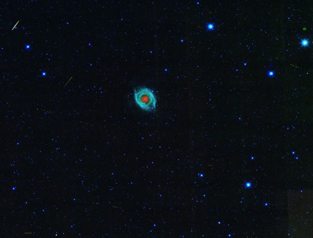 A dying star, called the Helix nebula, is shown surrounded by the tracks of asteroids in an image captured by NASA's Wide-field Infrared Survey Explorer, or WISE. Image credit: NASA/JPL-Caltech/UCLA A dying star, called the Helix nebula, is shown surrounded by the tracks of asteroids in an image captured by NASA's Wide-field Infrared Survey Explorer, or WISE. Image credit: NASA/JPL-Caltech/UCLA