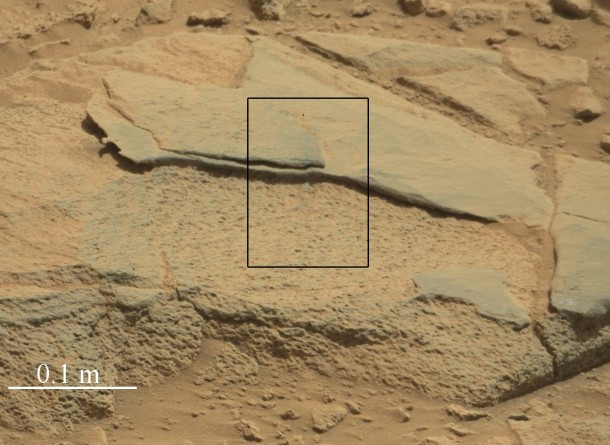 The rock "Ithaca" shown here, with a rougher lower texture and smoother texture on top, appears to be a piece of the local sedimentary bedrock protruding from the surrounding soil in Gale Crater. NASA's Curiosity Mars rover used its Mast Camera (Mastcam) to take this image during the 439th Martian day, or sol, of Curiosity's work on Mars (Oct. 30, 2013). Image Credit: NASA/JPL-Caltech/MSSS The rock "Ithaca" shown here, with a rougher lower texture and smoother texture on top, appears to be a piece of the local sedimentary bedrock protruding from the surrounding soil in Gale Crater. NASA's Curiosity Mars rover used its Mast Camera (Mastcam) to take this image during the 439th Martian day, or sol, of Curiosity's work on Mars (Oct. 30, 2013). Image Credit: NASA/JPL-Caltech/MSSS