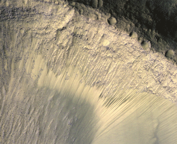 These images from the High Resolution Imaging Science Experiment (HiRISE) camera on NASA's Mars Reconnaissance Orbiter show how the appearance of dark markings on Martian slope changes with the seasons. Image credit: NASA/JPL-Caltech/Univ. of Arizona These images from the High Resolution Imaging Science Experiment (HiRISE) camera on NASA's Mars Reconnaissance Orbiter show how the appearance of dark markings on Martian slope changes with the seasons. Image credit: NASA/JPL-Caltech/Univ. of Arizona