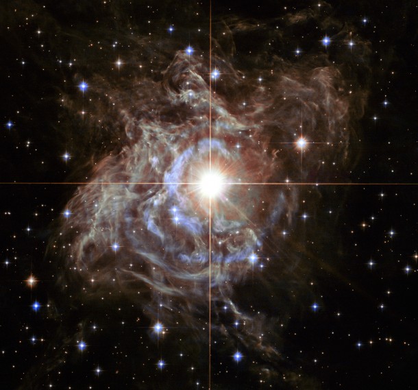 This festive NASA Hubble Space Telescope image resembles a holiday wreath made of sparkling lights. The bright southern hemisphere star RS Puppis, at the center of the image, is swaddled in a gossamer cocoon of reflective dust illuminated by the glittering star. Image Credit: NASA/ESA/Hubble Heritage (STScI/AURA)-Hubble/Europe Collab. This festive NASA Hubble Space Telescope image resembles a holiday wreath made of sparkling lights. The bright southern hemisphere star RS Puppis, at the center of the image, is swaddled in a gossamer cocoon of reflective dust illuminated by the glittering star. Image Credit: NASA/ESA/Hubble Heritage (STScI/AURA)-Hubble/Europe Collab.