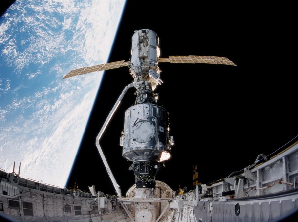 In this large-format IMAX camera view from the space shuttle Endeavour's cargo bay, the crew of STS-88 began construction of the International Space Station. Mission specialist Nancy Currie used Endeavour's Canadarm remote manipulator system to grapple Zarya and join it to the U.S.-built Unity node on Dec. 6, 1998. Image Credit: NASA/IMAX In this large-format IMAX camera view from the space shuttle Endeavour's cargo bay, the crew of STS-88 began construction of the International Space Station. Mission specialist Nancy Currie used Endeavour's Canadarm remote manipulator system to grapple Zarya and join it to the U.S.-built Unity node on Dec. 6, 1998. Image Credit: NASA/IMAX