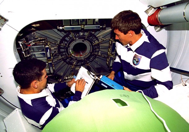 On Dec. 10, 1998, STS-88 commander Bob Cabana, left, and Russian cosmonaut Sergei Krikalev prepare to move from the shuttle Endeavour's airlock into the U.S.-built node 1, also known as the Unity module. Soon after, they entered the Russian-built Functional Cargo Block module, also known as Zarya. Image Credit: NASA On Dec. 10, 1998, STS-88 commander Bob Cabana, left, and Russian cosmonaut Sergei Krikalev prepare to move from the shuttle Endeavour's airlock into the U.S.-built node 1, also known as the Unity module. Soon after, they entered the Russian-built Functional Cargo Block module, also known as Zarya. Image Credit: NASA