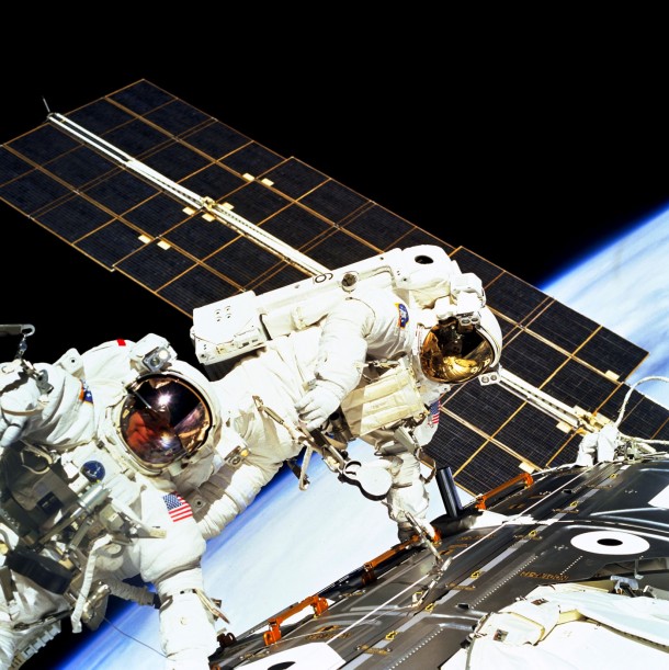 Once the two space station elements were docked, mission specialists Jerry Ross, left, and Jim Newman conducted three spacewalks to connect power and data cables between the Unity and Zarya. In this image they were photographed working together on the third spacewalk on Dec. 12, 1998. Image Credit: NASA Once the two space station elements were docked, mission specialists Jerry Ross, left, and Jim Newman conducted three spacewalks to connect power and data cables between the Unity and Zarya. In this image they were photographed working together on the third spacewalk on Dec. 12, 1998. Image Credit: NASA