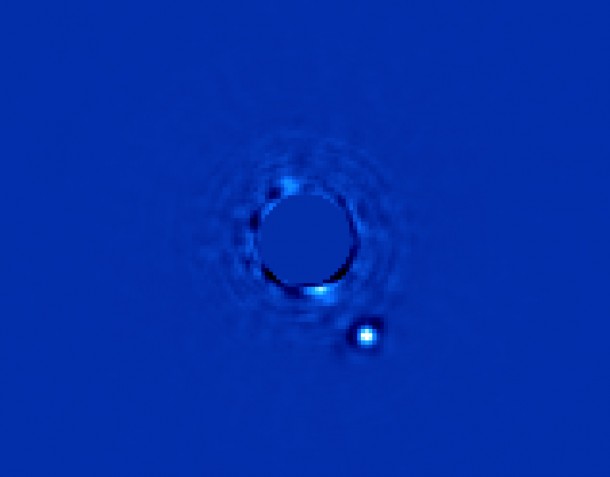 Figure 1. Gemini Planet Imager’s first light image of Beta Pictoris b, a planet orbiting the star Beta Pictoris. The star, Beta Pictoris, is blocked in this image by a mask so its light doesn’t interfere with the light of the planet. In addition to the image, GPI obtains a spectrum from every pixel element in the field of view to allow scientists to study the planet in great detail. Image credit: Processing by Christian Marois, NRC Canada. Figure 1. Gemini Planet Imager’s first light image of Beta Pictoris b, a planet orbiting the star Beta Pictoris. The star, Beta Pictoris, is blocked in this image by a mask so its light doesn’t interfere with the light of the planet. In addition to the image, GPI obtains a spectrum from every pixel element in the field of view to allow scientists to study the planet in great detail. Image credit: Processing by Christian Marois, NRC Canada.