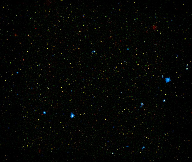 A range of supermassive black holes lights up this new image from NASA's Nuclear Spectroscopic Telescope Array, or NuSTAR. All of the dots are active black holes tucked inside the hearts of galaxies, with colors representing different energies of X-ray light. Image credit: NASA/JPL-Caltech/Yale University A range of supermassive black holes lights up this new image from NASA's Nuclear Spectroscopic Telescope Array, or NuSTAR. All of the dots are active black holes tucked inside the hearts of galaxies, with colors representing different energies of X-ray light. Image credit: NASA/JPL-Caltech/Yale University