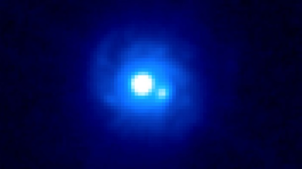 This Hubble image of gravitational lens B0218+357 reveals two bright sources separated by about a third of an arcsecond, each an image of the background blazar. Spiral arms belonging to the lensing galaxy also can be seen. B0218+357 boasts the smallest separation of lensed images currently known. Image Credit: NASA/ESA and the Hubble Legacy Archive This Hubble image of gravitational lens B0218+357 reveals two bright sources separated by about a third of an arcsecond, each an image of the background blazar. Spiral arms belonging to the lensing galaxy also can be seen. B0218+357 boasts the smallest separation of lensed images currently known. Image Credit: NASA/ESA and the Hubble Legacy Archive