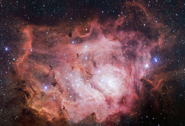 The VLT Survey Telescope (VST) at ESO's Paranal Observatory in Chile has captured this richly detailed new image of the Lagoon Nebula. This giant cloud of gas and dust is creating intensely bright young stars, and is home to young stellar clusters. This image is a tiny part of just one of eleven public surveys of the sky now in progress using ESO telescopes. Together these are providing a vast legacy of publicly available data for the global astronomical community. Credit: ESO/VPHAS+ team The VLT Survey Telescope (VST) at ESO's Paranal Observatory in Chile has captured this richly detailed new image of the Lagoon Nebula. This giant cloud of gas and dust is creating intensely bright young stars, and is home to young stellar clusters. This image is a tiny part of just one of eleven public surveys of the sky now in progress using ESO telescopes. Together these are providing a vast legacy of publicly available data for the global astronomical community. Credit: ESO/VPHAS+ team