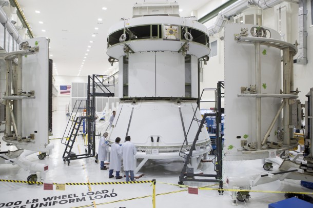 Engineers prepare Orion’s service module for installation of the fairings that will protect it during launch this fall when Orion launches on its first mission. The service module, along with its fairings, is now complete. Image Credit: NASA Engineers prepare Orion’s service module for installation of the fairings that will protect it during launch this fall when Orion launches on its first mission. The service module, along with its fairings, is now complete. Image Credit: NASA