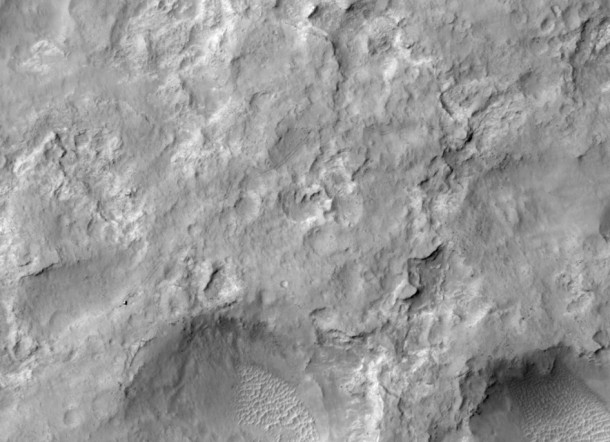 NASA's Curiosity Mars rover and tracks left by its driving appear in this portion of a Dec. 11, 2013, observation by the High Resolution Imaging Science Experiment (HiRISE) camera on NASA's Mars Reconnaissance Orbiter. The rover is near the lower-left corner of this view. Image Credit: NASA/JPL-Caltech/Univ. of Arizona NASA's Curiosity Mars rover and tracks left by its driving appear in this portion of a Dec. 11, 2013, observation by the High Resolution Imaging Science Experiment (HiRISE) camera on NASA's Mars Reconnaissance Orbiter. The rover is near the lower-left corner of this view. Image Credit: NASA/JPL-Caltech/Univ. of Arizona