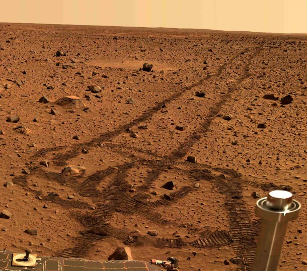 This image was taken on May 21, 25 and 26, 2004, by the panoramic camera on NASA's Mars Exploration Rover, Spirit. Clearly visible in the soil are the tracks made by the spacecraft's six wheels. The tubular object in the lower right is Spirit's low-gain antenna. Image Credit: NASA/JPL/Cornell University This image was taken on May 21, 25 and 26, 2004, by the panoramic camera on NASA's Mars Exploration Rover, Spirit. Clearly visible in the soil are the tracks made by the spacecraft's six wheels. The tubular object in the lower right is Spirit's low-gain antenna. Image Credit: NASA/JPL/Cornell University