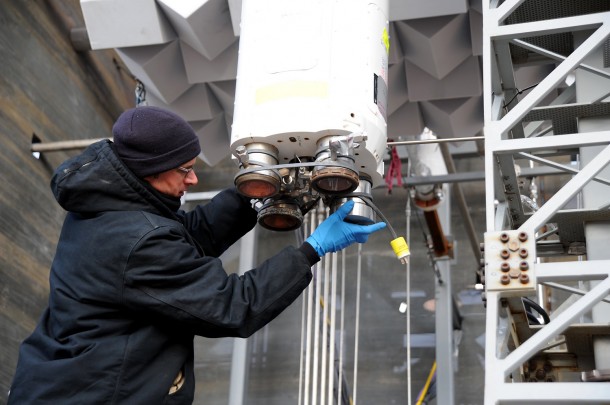 Michael Martin, an InfoPro Corp. employee supporting Marshall's Test Laboratory, installs a leak check fixture on one of the liquid oxygen (LOX)/hydrogen thrusters ahead of testing on the scale model. Image Credit: NASA/MSFC/David Olive Michael Martin, an InfoPro Corp. employee supporting Marshall's Test Laboratory, installs a leak check fixture on one of the liquid oxygen (LOX)/hydrogen thrusters ahead of testing on the scale model. Image Credit: NASA/MSFC/David Olive
