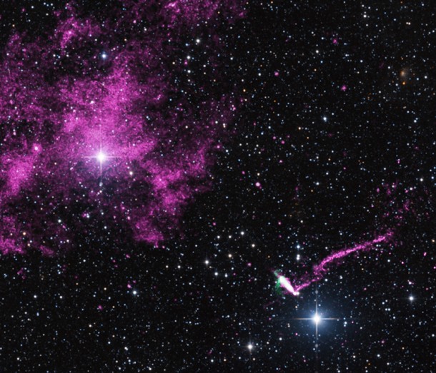 An extraordinary jet trailing behind a runaway pulsar is seen in this composite image that contains data from Chandra (purple), radio data from the ACTA (green), and optical data from the 2MASS survey (red, green, and blue). The pulsar and its tail are found in the lower right of this image. Image Credit: NASA/CXC/ISDC An extraordinary jet trailing behind a runaway pulsar is seen in this composite image that contains data from Chandra (purple), radio data from the ACTA (green), and optical data from the 2MASS survey (red, green, and blue). The pulsar and its tail are found in the lower right of this image. Image Credit: NASA/CXC/ISDC