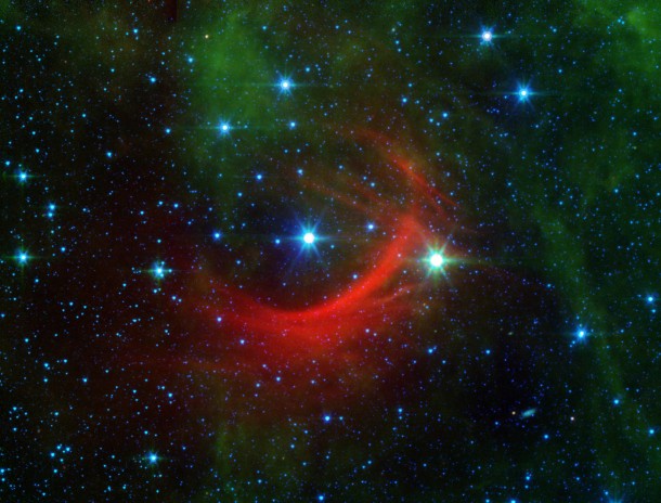 The red arc in this infrared image from NASA's Spitzer Space Telescope is a giant shock wave, created by a speeding star known as Kappa Cassiopeiae. Image credit: NASA/JPL-Caltech The red arc in this infrared image from NASA's Spitzer Space Telescope is a giant shock wave, created by a speeding star known as Kappa Cassiopeiae. Image credit: NASA/JPL-Caltech