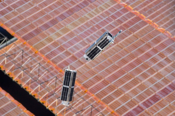 A set of NanoRacks CubeSats is photographed by an Expedition 38 crew member after the deployment by the NanoRacks Launcher attached to the end of the Japanese robotic arm on Feb. 14. Image Credit: NASA A set of NanoRacks CubeSats is photographed by an Expedition 38 crew member after the deployment by the NanoRacks Launcher attached to the end of the Japanese robotic arm on Feb. 14. Image Credit: NASA
