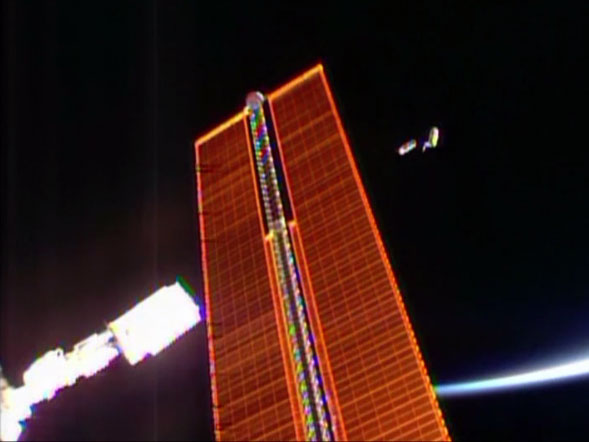 A pair of Cubesats are deployed outside the International Space Station's Kibo laboratory. Image Credit: NASA TV A pair of Cubesats are deployed outside the International Space Station's Kibo laboratory. Image Credit: NASA TV