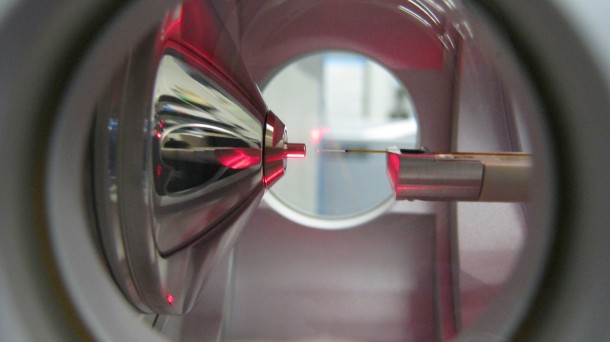 This equipment is used by Goddard's Astrobiology Analytical Lab to analyze very small samples. On the right is the nanoelectrospray emitter, which gives sample molecules an electric charge and transfers them to the inlet of the mass spectrometer (left), which identifies the molecules by their mass. Image Credit: Michael Callahan This equipment is used by Goddard's Astrobiology Analytical Lab to analyze very small samples. On the right is the nanoelectrospray emitter, which gives sample molecules an electric charge and transfers them to the inlet of the mass spectrometer (left), which identifies the molecules by their mass. Image Credit: Michael Callahan