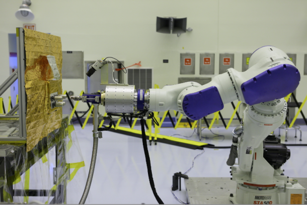 Located at Kennedy but commanded from Goddard, the RROxiTT industrial robot mimics how future space robots could transfer oxidizer to satellites that were not designed to be serviced. Image Credit: NASA/KSC Located at Kennedy but commanded from Goddard, the RROxiTT industrial robot mimics how future space robots could transfer oxidizer to satellites that were not designed to be serviced. Image Credit: NASA/KSC