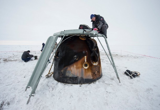 The Soyuz TMA-10 spacecraft that returned Expedition 38 to Earth is examined by Russian engineers as cargo is removed at its landing site in Kazakhstan. Image Credit: NASA/Bill Ingalls The Soyuz TMA-10 spacecraft that returned Expedition 38 to Earth is examined by Russian engineers as cargo is removed at its landing site in Kazakhstan. Image Credit: NASA/Bill Ingalls