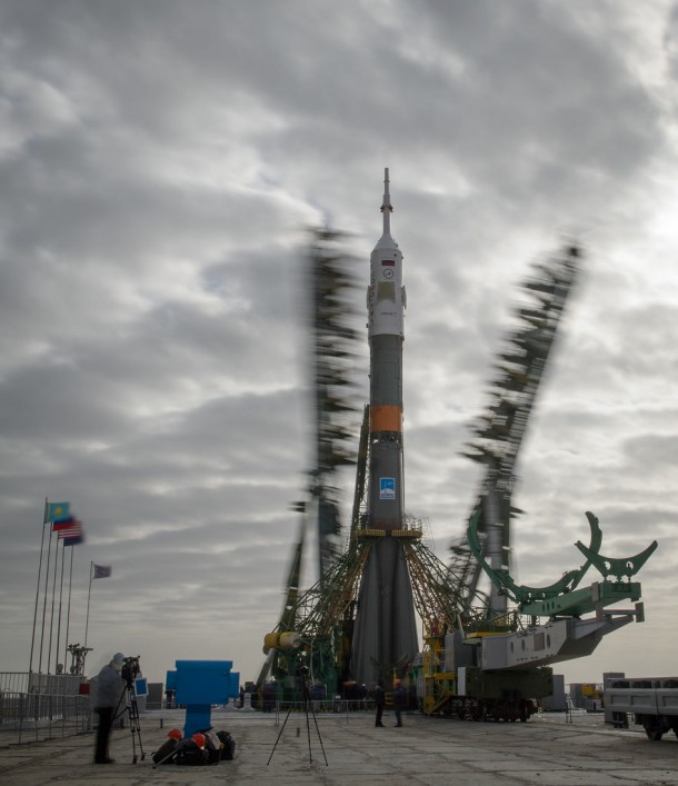 The gantry arms begin to close around the Soyuz TMA-12M spacecraft to secure the rocket Image Credit: NASA/Bill Ingalls The gantry arms begin to close around the Soyuz TMA-12M spacecraft to secure the rocket Image Credit: NASA/Bill Ingalls