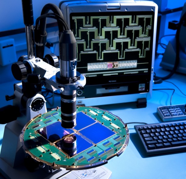 The BICEP2 telescope at the South Pole used a specialized array of superconducting detectors to capture polarized light from billions of years ago. The detector array is shown here, under a microscope. Techniques called micro-lithography and micro-machining are used to fabricate the devices. Image Credit: NASA/JPL-Caltech The BICEP2 telescope at the South Pole used a specialized array of superconducting detectors to capture polarized light from billions of years ago. The detector array is shown here, under a microscope. Techniques called micro-lithography and micro-machining are used to fabricate the devices. Image Credit: NASA/JPL-Caltech