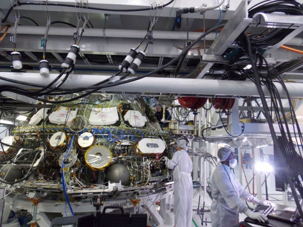Engineers in the Operations and Checkout Building at NASA’s Kennedy Space Center in Florida, perform avionics testing on the Orion spacecraft being prepared for its first trip to space later this year. Image Credit: Lockheed Martin Engineers in the Operations and Checkout Building at NASA’s Kennedy Space Center in Florida, perform avionics testing on the Orion spacecraft being prepared for its first trip to space later this year. Image Credit: Lockheed Martin
